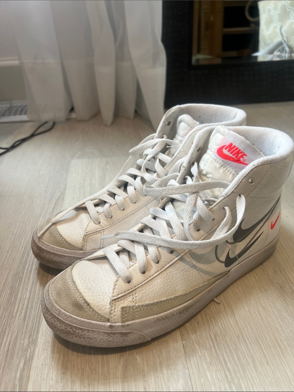 Nike White High-Top Sneakers with Pink Swoosh